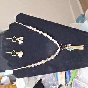 Whimsical pink tone rabbit necklace and earring set